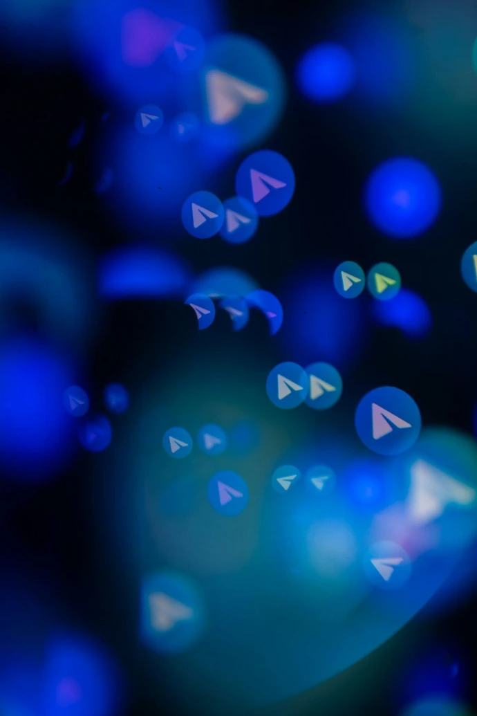 Abstract blue bokeh lights with paper airplane icons